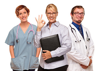 Image showing Businesswoman Making Okay Hand Sign with Doctors or Nurses