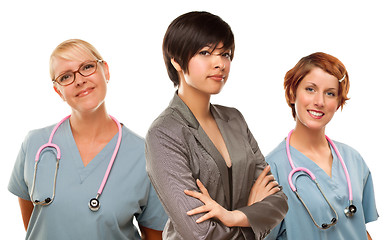 Image showing Young Mixed Race Woman with Doctors and Nurses Behind