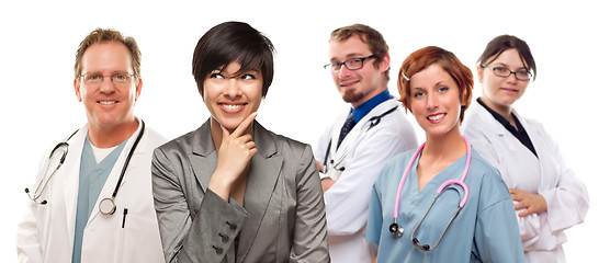 Image showing Young Mixed Race Woman with Doctors and Nurses Behind