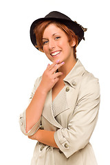 Image showing Attractive Red Haired Girl Wearing a Trench Coat and Hat