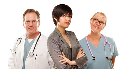 Image showing Young Mixed Race Woman with Doctors and Nurses Behind