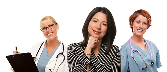 Image showing Hispanic Woman with Female Doctors and Nurses