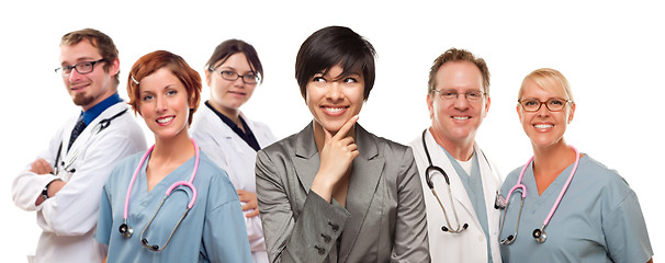 Image showing Young Mixed Race Woman with Doctors and Nurses Behind