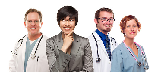 Image showing Young Mixed Race Woman with Doctors and Nurses Behind