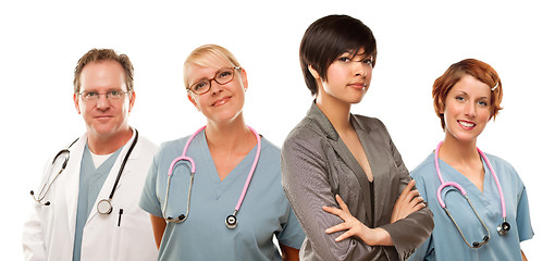 Image showing Young Mixed Race Woman with Doctors and Nurses Behind