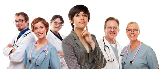 Image showing Young Mixed Race Woman with Doctors and Nurses Behind