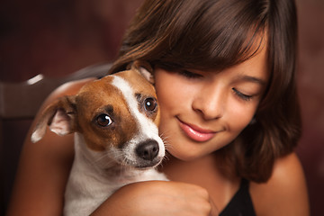 Image showing Pretty Hispanic Girl and Her Puppy Studio Portrait