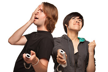 Image showing Mixed Race Couple Playing Video Game Remotes on White