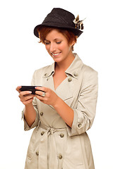 Image showing Smiling Young Woman Holding Smart Cell Phone on White