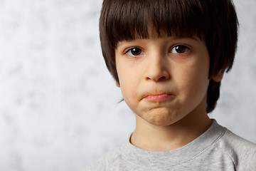 Image showing portrait of a stubborn boy