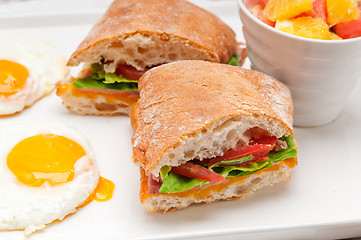 Image showing ciabatta panini sandwich eggs tomato lettuce