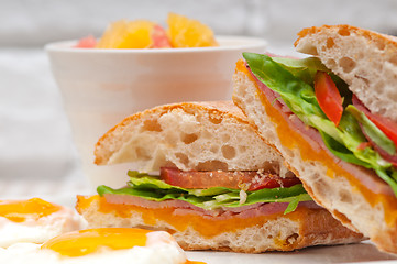 Image showing ciabatta panini sandwich eggs tomato lettuce