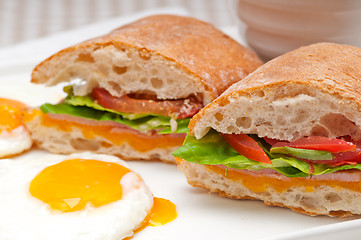 Image showing ciabatta panini sandwich eggs tomato lettuce