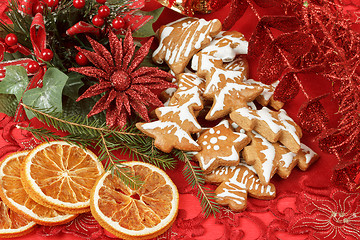 Image showing christmas background with needles. orange slices and gingerbreads