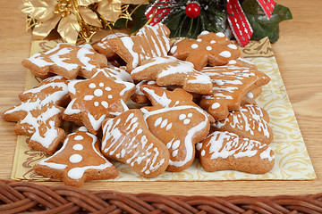 Image showing christmas gingerbreads and decoration on wooden table