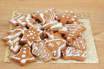 Image showing christmas gingerbreads on wooden table
