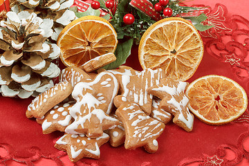 Image showing christmas background with needles. orange slices and gingerbreads