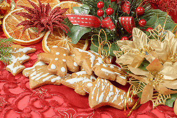 Image showing christmas background with needles. orange slices and gingerbreads