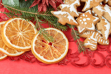 Image showing christmas background with needles. orange slices and gingerbreads