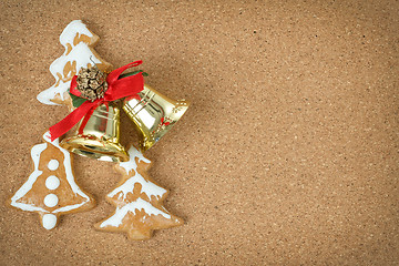 Image showing corcboard with ginger bread and christmas bells