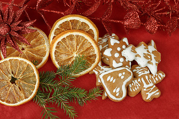 Image showing christmas background with needles. orange slices and gingerbreads