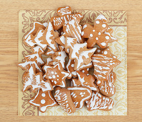 Image showing christmas gingerbreads on wooden table