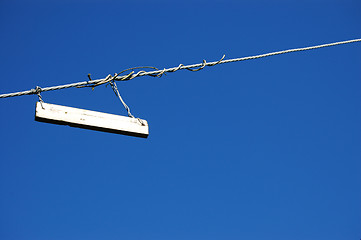 Image showing Plain white sign against a blue sky