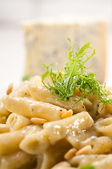 Image showing Italian pasta penne gorgonzola and pine nuts