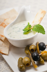 Image showing Greek Tzatziki yogurt dip and pita bread