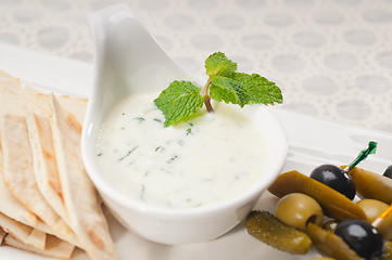 Image showing Greek Tzatziki yogurt dip and pita bread