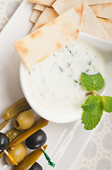 Image showing Greek Tzatziki yogurt dip and pita bread