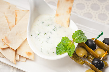 Image showing Greek Tzatziki yogurt dip and pita bread