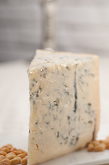 Image showing gorgonzola cheese fresh cut and pinenuts