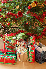 Image showing detail of gifts under decorated christmas tree