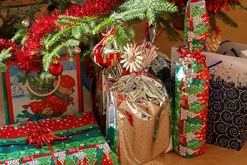 Image showing detail of gifts under decorated christmas tree