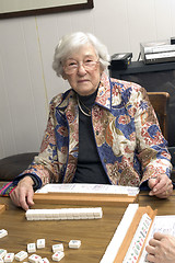 Image showing senior woman at the game table