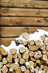 Image showing Birch fire wood at a wall of the house in winter