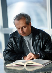 Image showing Mature man reading