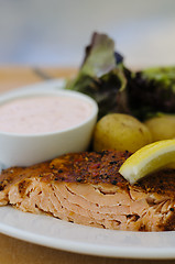 Image showing Salmon fillet, potatoes and hollandaise sauce