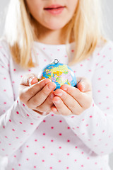 Image showing Holding world in hands