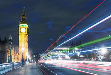 Image showing Tower Bridge in London, UK at night with traffic and moving red 