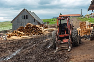 Image showing Wood industry outdoorsm with red tractor