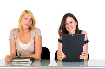 Image showing Two beautiful student girls getting ready for school