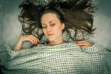 Image showing Young woman in the bed