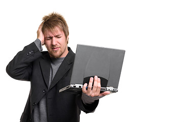 Image showing Young man with laptop