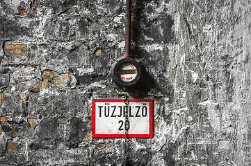 Image showing Fire alarm on old brick wall