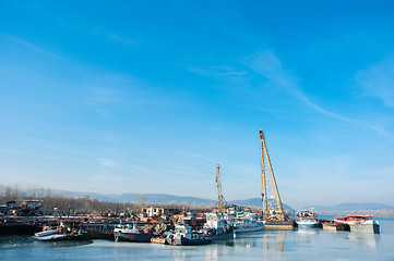 Image showing Part of an industrial plant at the shores of a river