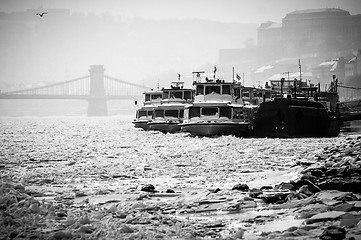 Image showing Big boats stuck in the ice at winter