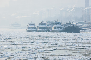 Image showing Big boats stuck in the ice at winter