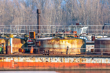 Image showing Part of an industrial plant at the shores of a river